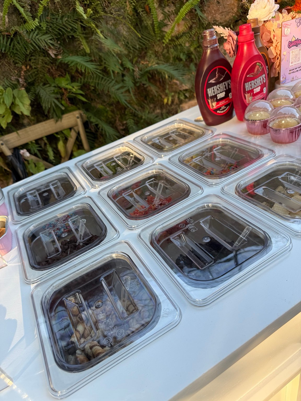 Interactive dessert cart toppings station in Jamaica